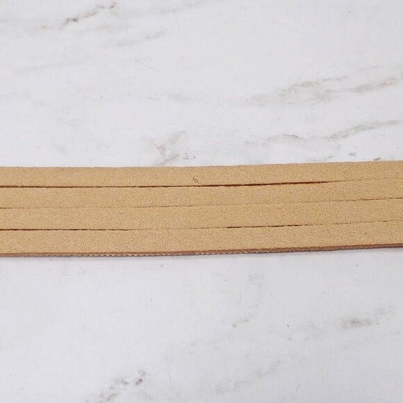 Wide gold chain bracelet with four rows of chain backed with a soft suede. - Picture 10 of 12